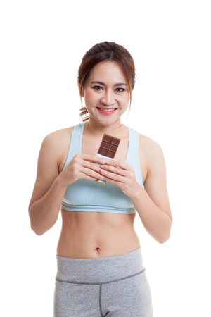 Beautiful healthy Asian girl love chocolate  isolated on white background.の写真素材