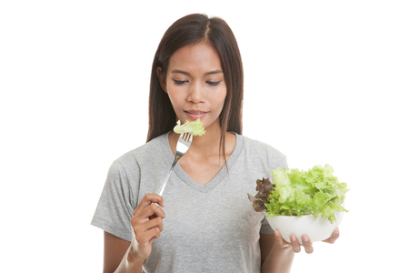 Healthy Asian  woman with salad  isolated on white background.の写真素材