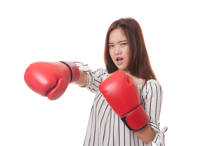 Young Asian woman with red boxing gloves isolated on white backgroundの写真素材