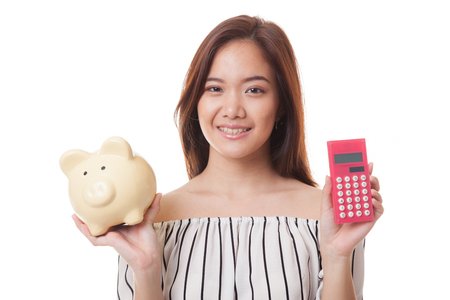 Asian woman with calculator and piggy bank isolated on white backgroundの写真素材