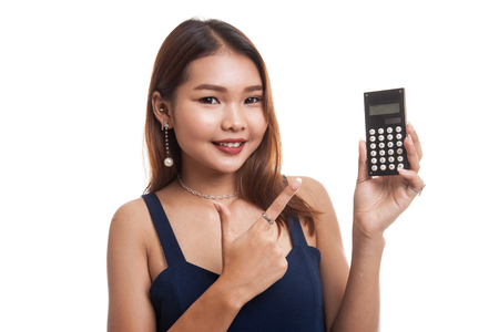 Asian woman point to  calculator isolated on white backgroundの写真素材