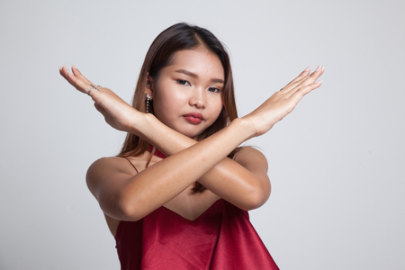 Beautiful young Asian woman say no on gray backgroundの写真素材