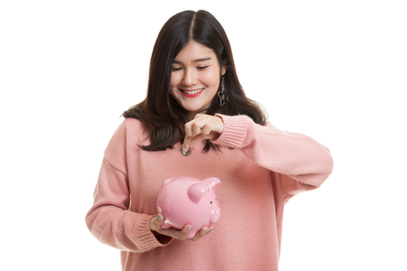 Asian woman with coin and pig coin bank isolated on white backgroundの写真素材