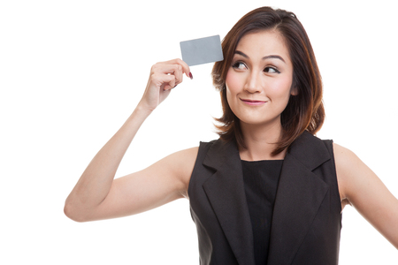Young Asian woman think with a blank card isolated on white backgroundの写真素材