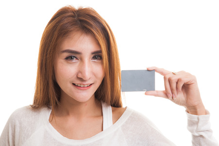 Young Asian woman smile with blank card  isolated on white backgroundの写真素材