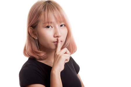 Asian girl show quite hand sign isolated on white backgroundの写真素材