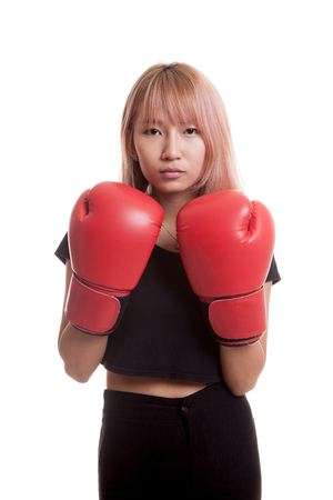 Young Asian woman with red boxing gloves isolated on white backgroundの写真素材