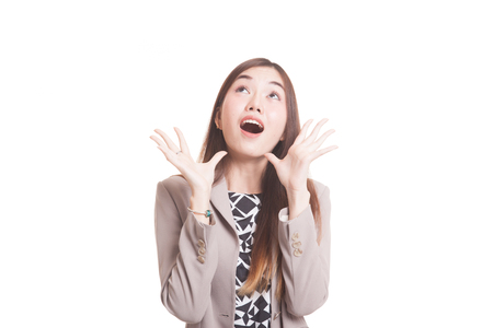 Excited young Asian woman look up isolated on white backgroundの写真素材