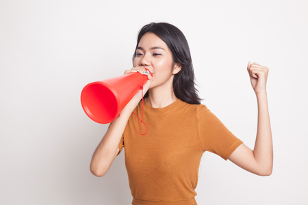Beautiful young Asian woman announce with megaphone on white backgroundの写真素材