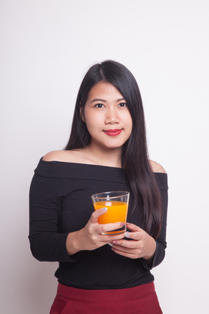Young Asian woman drink orange juice on white backgroundの写真素材