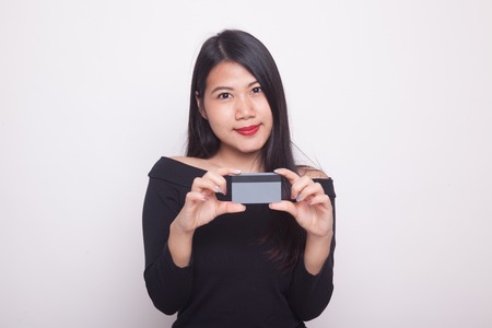 Young Asian woman smile with blank card on white backgroundの写真素材