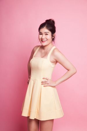 Portrait of beautiful young Asian woman on pink backgroundの写真素材