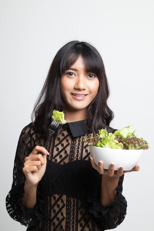Healthy Asian woman with salad on white backgroundの写真素材