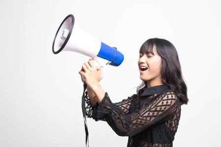 Beautiful young Asian woman announce with megaphone on white backgroundの写真素材