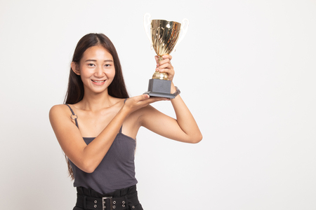 Successful young asian woman holding a trophy on white backgroundの写真素材