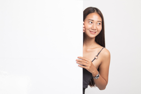 Young Asian woman with blank sign on white backgroundの写真素材