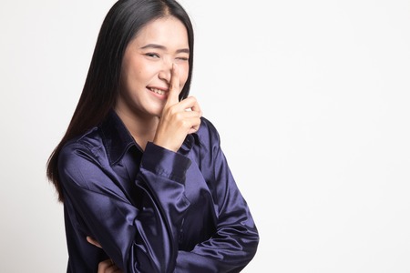 Asian girl show quite hand sign on white background