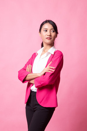 Portrait of beautiful young Asian woman on pink backgroundの写真素材