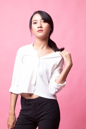 Portrait of beautiful young Asian woman on pink backgroundの写真素材