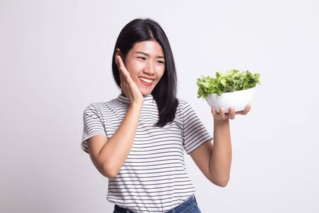 Healthy Asian woman with salad on white backgroundの写真素材