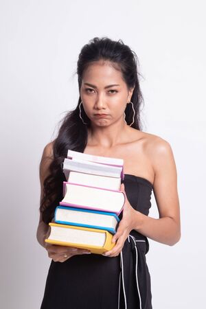 Unhappy young Asian woman studying  with may books on white background