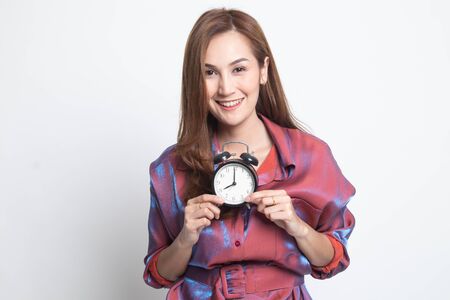 Young Asian woman smile with a clock on white background