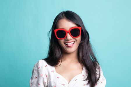 Portrait of a beautiful young asian girl in sunglasses