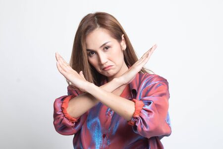 Beautiful young Asian woman say no on white background