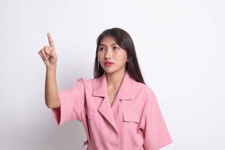 Asian woman touching the screen with her finger on white background.の写真素材
