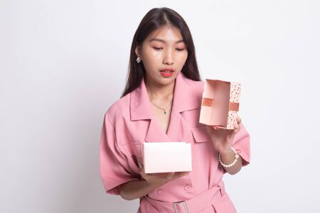 Young Asian woman open a gift box on white background.の写真素材