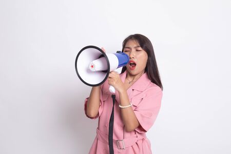 Beautiful young Asian woman announce with megaphone on white background.の写真素材