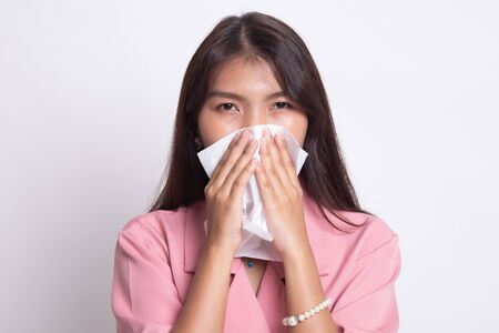 Young Asian woman got sick and flu on white background.の写真素材