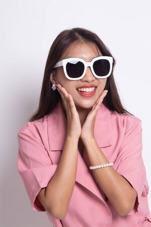 Portrait of a beautiful young asian girl in sunglasses on white background.の写真素材