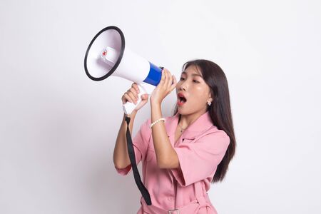Beautiful young Asian woman announce with megaphone on white background.の写真素材