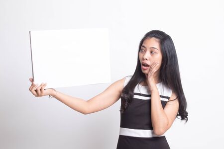 Young Asian woman  surprise with  white blank sign on white backgroundの写真素材