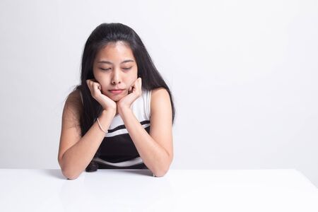 Asian girl with sad emotion on white backgroundの写真素材