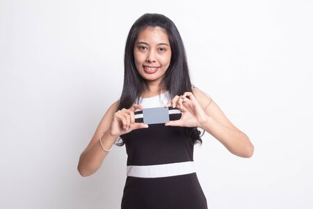 Young Asian woman smile with blank card on white backgroundの写真素材
