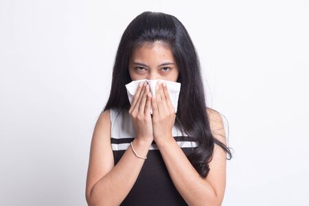 Young Asian woman got sick and flu on white backgroundの写真素材