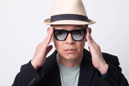 Portrait of an adult asian man  in sunglasses on white backgroundの写真素材