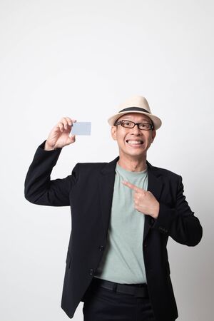 adult asian man point to a blank card on white backgroundの写真素材