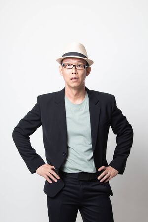 Portrait of  an adult asian man on white backgroundの写真素材
