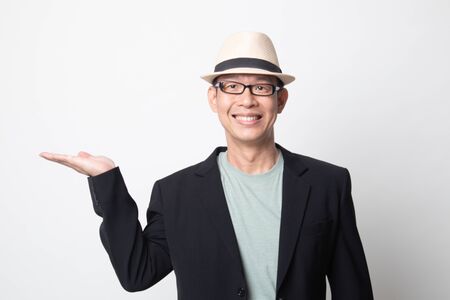 adult asian man show palm hand on white backgroundの写真素材