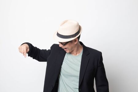 adult asian man  point down to blank space on white backgroundの写真素材