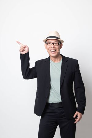 an adult asian man  smile and point on white backgroundの写真素材