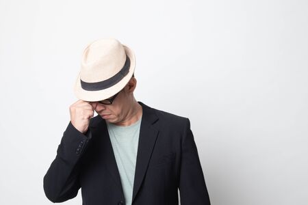 adult asian man got sick and  headache on white backgroundの写真素材