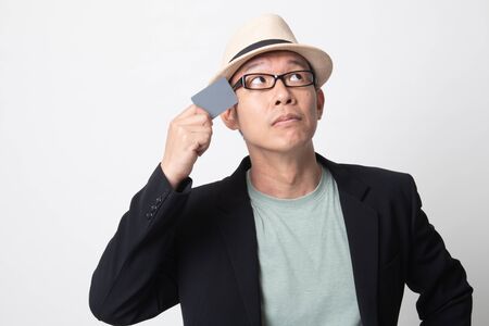 adult asian man  think with a blank card on white backgroundの写真素材