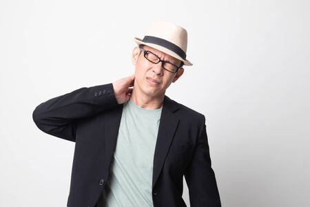 adult asian man got neck pain on white backgroundの写真素材