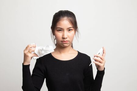 Young Asian woman got sick and flu on white backgroundの写真素材
