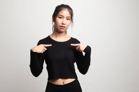 Young Asian woman point at herself ask why me on white backgroundの写真素材