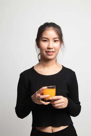 Young Asian woman drink orange juice on white backgroundの写真素材